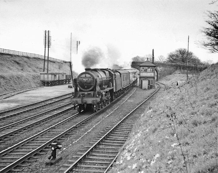 Loco 46112.jpg - Number  46122   "Royal Ulster Rifleman"   - The Royal Scot class was designed by  Henry Fowler and rebuilt by William Stanier.   Photographed on 5th May 1956, with Thames / Waverley. Built Nov 1927 by the North British Locomotive Works at Glasgow for the LMS Railway.  A total of 70 of this class were built in 1927 and 1930; they were designed for express passenger service. In 1948 its shed was Longsight. It's last shed was Carlisle Upperby. Withdrawn from service in Oct/Nov 1964 & disposed of in Feb 1965.